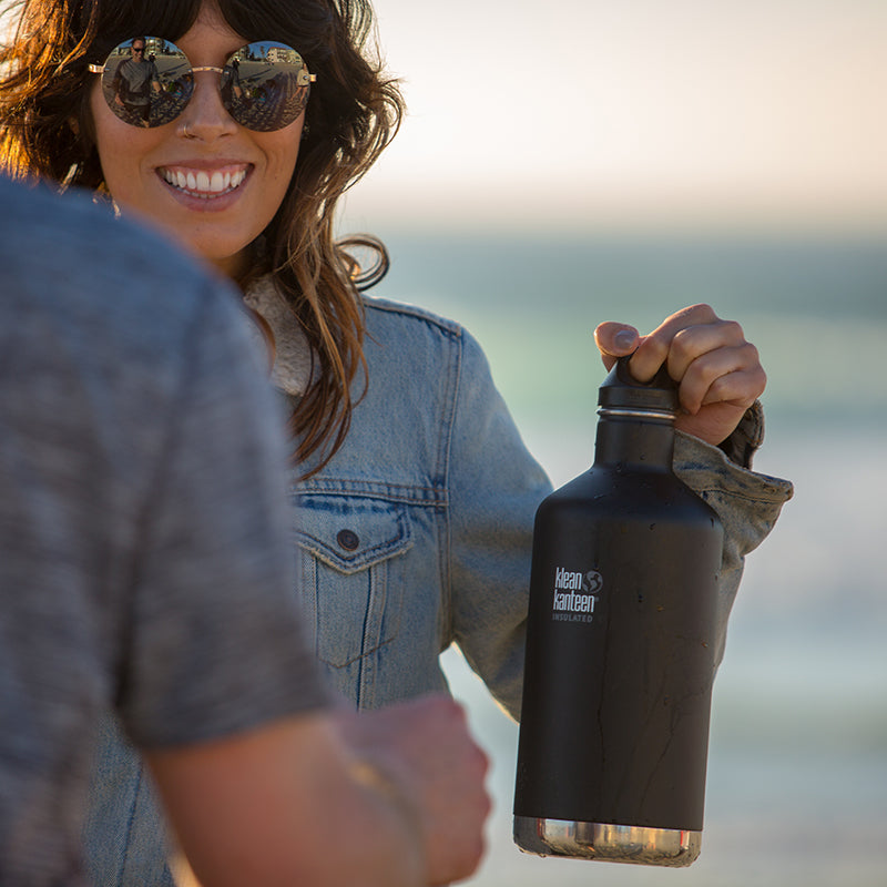 64oz-classic-with-loop-cap-f0 64oz_insulated_classic_black_beach_girl_hand_square.jpg